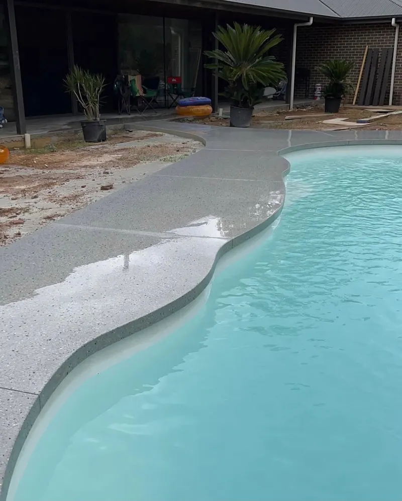 The curved pool surround path running past the house at Bargo