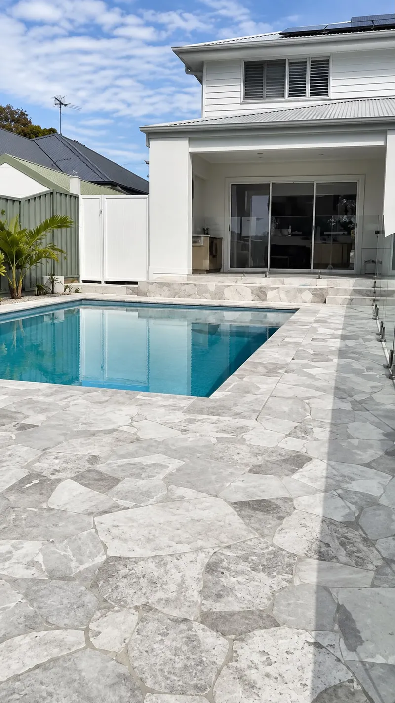 Close view of the travertine pool surround and pool at Caringbah, NSW