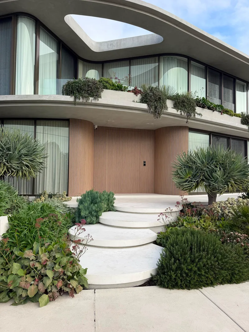 The floating steps at Drummoyne leading up to the timber-battened front entry