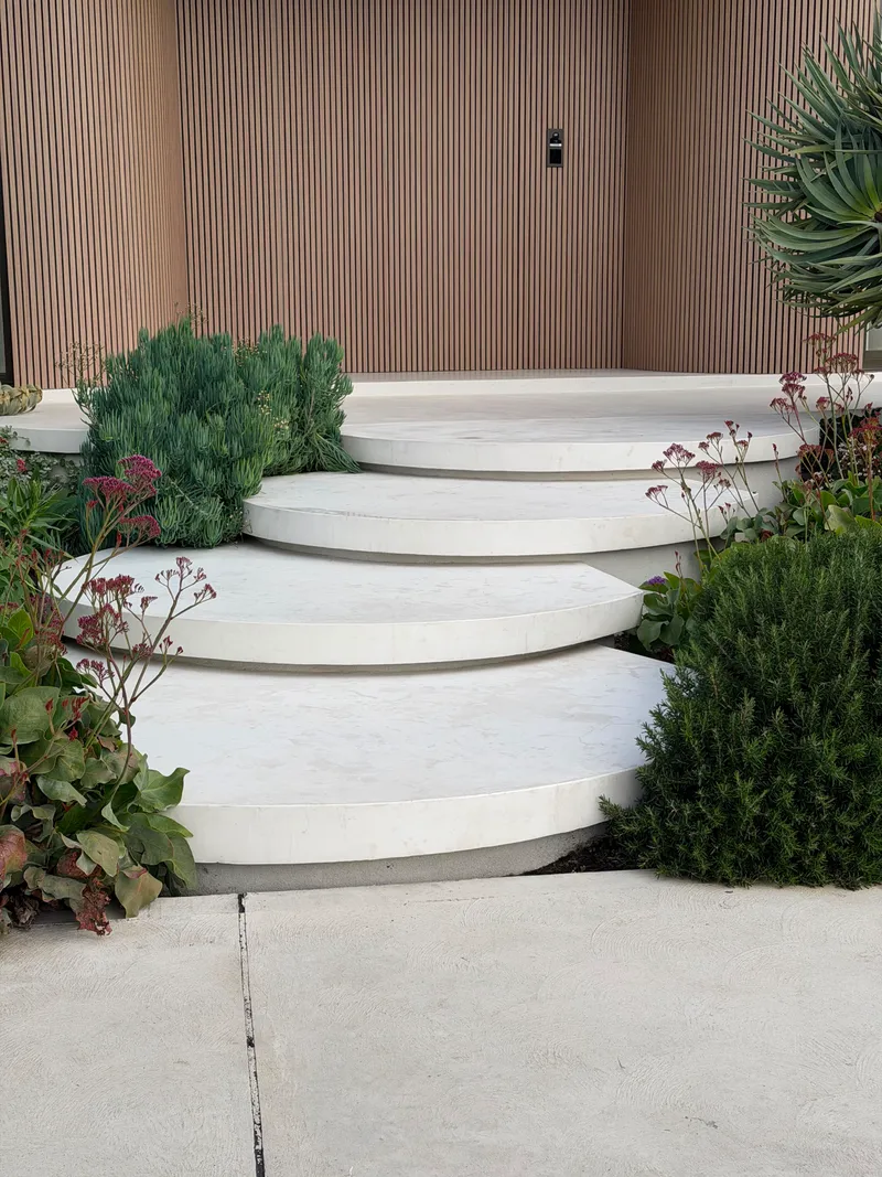 Close view of the rounded floating steps at Drummoyne, each tread curving out over the one below