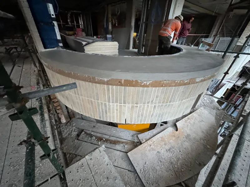 The crew working on the in-situ formwork for a curved window sill at Elizabeth Bay