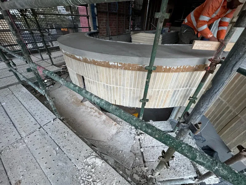 A freshly poured curved window sill after the formwork was stripped, Elizabeth Bay