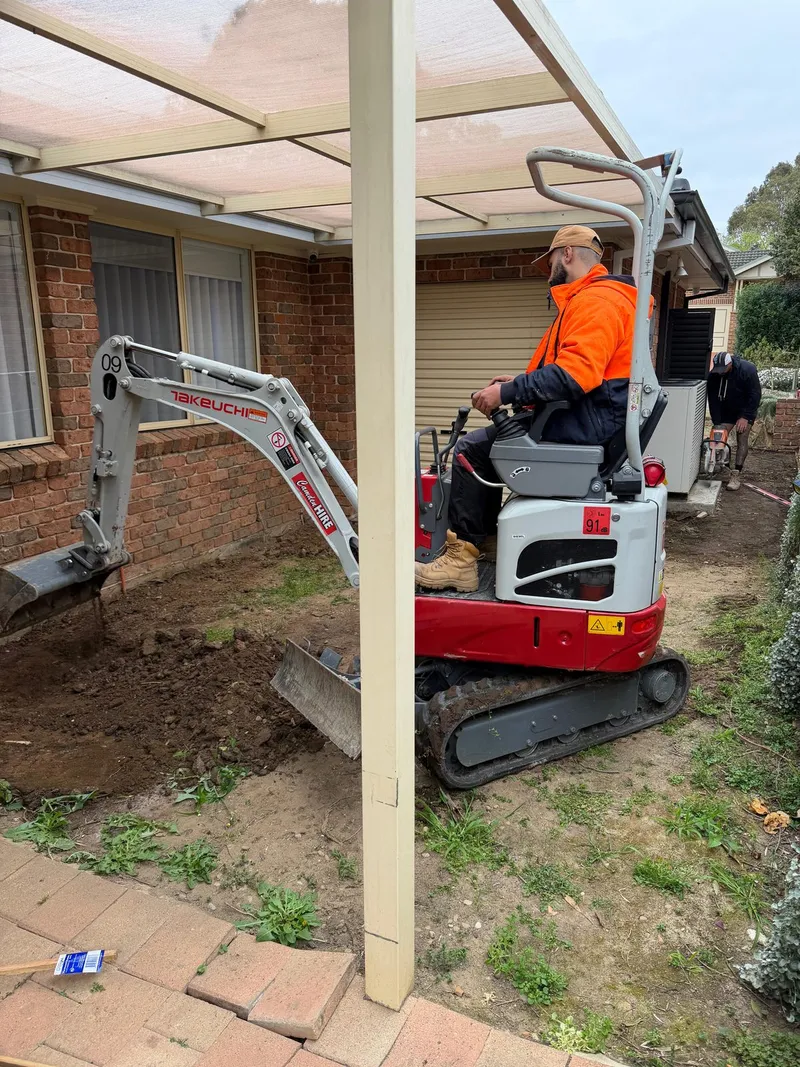 Excavating the old pavers in the backyard at Holsworthy