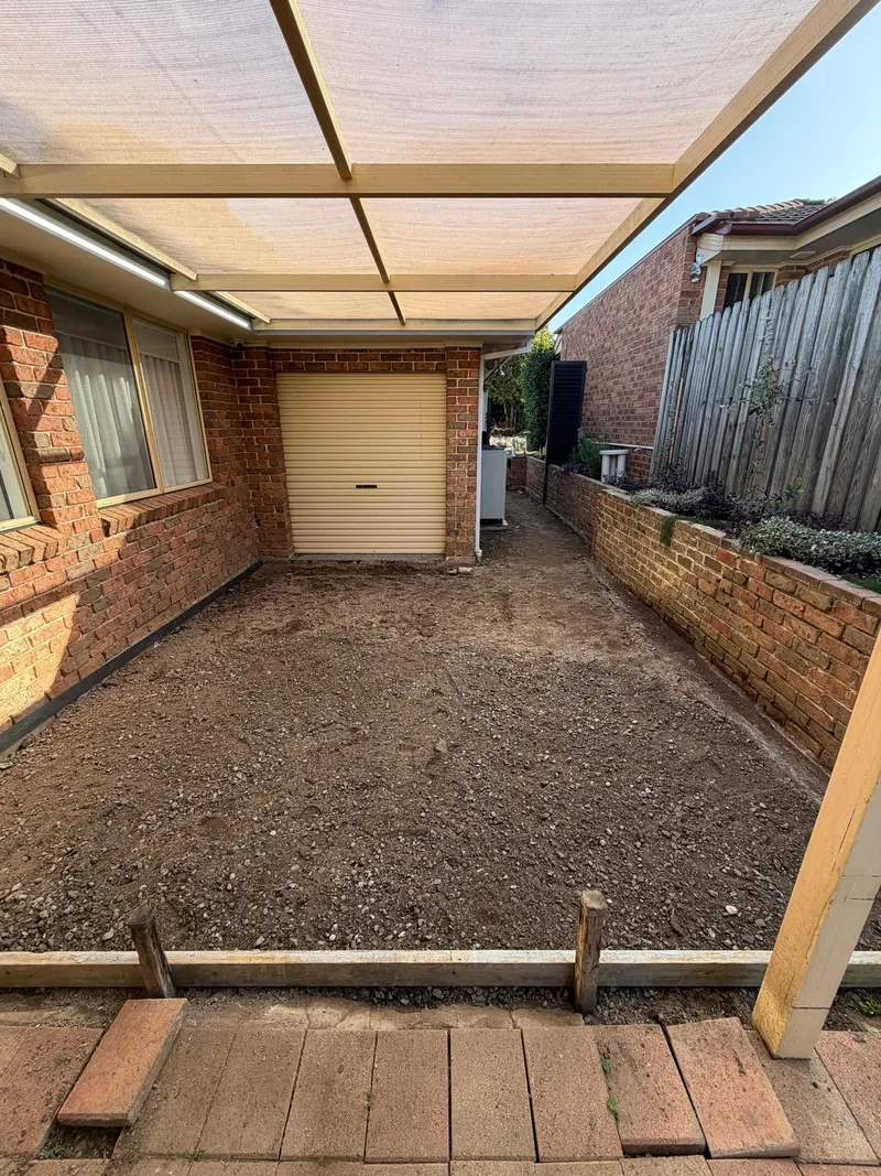The backyard excavated and prepped with roadbase before the matching exposed aggregate concrete was poured