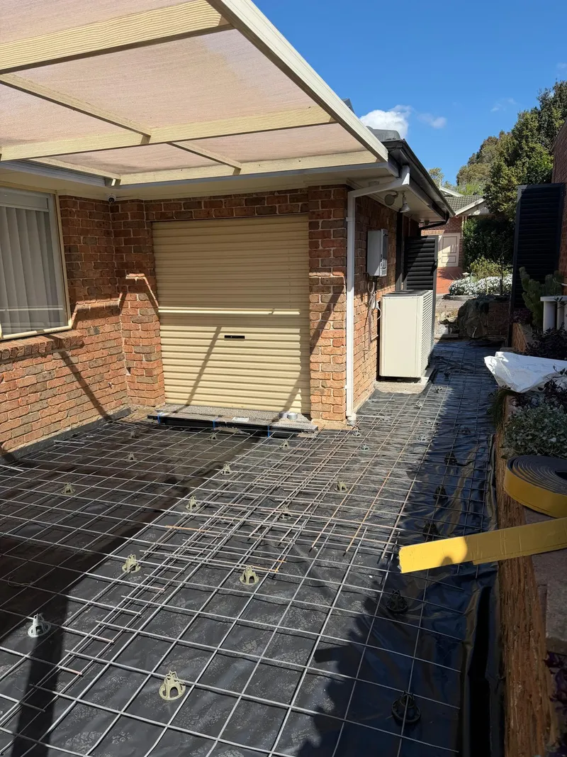 Steel reinforcement laid out in the backyard at Holsworthy before the pour