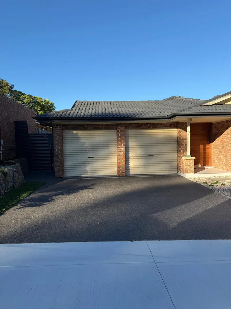 Wide view of the finished driveway and front yard at Holsworthy
