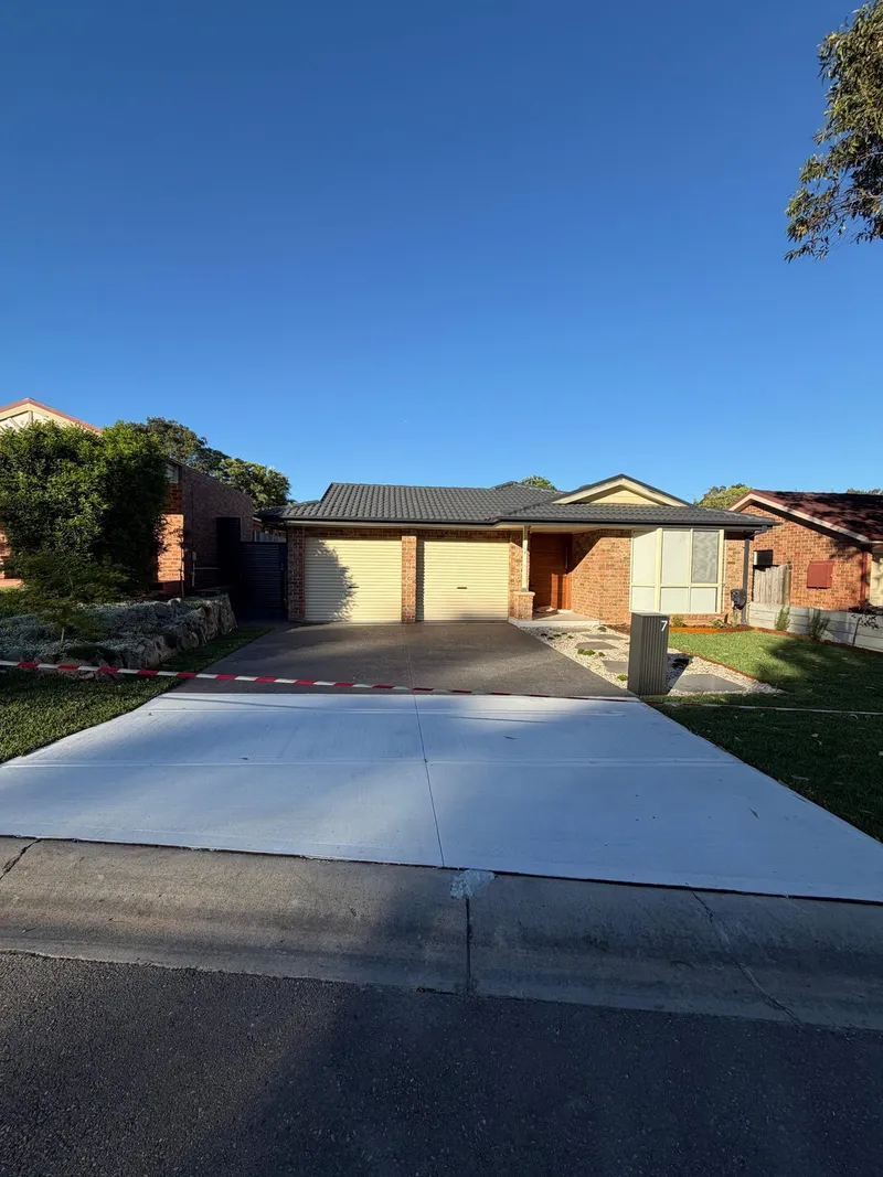 The finished driveway, new mailbox and front yard landscaping at Holsworthy