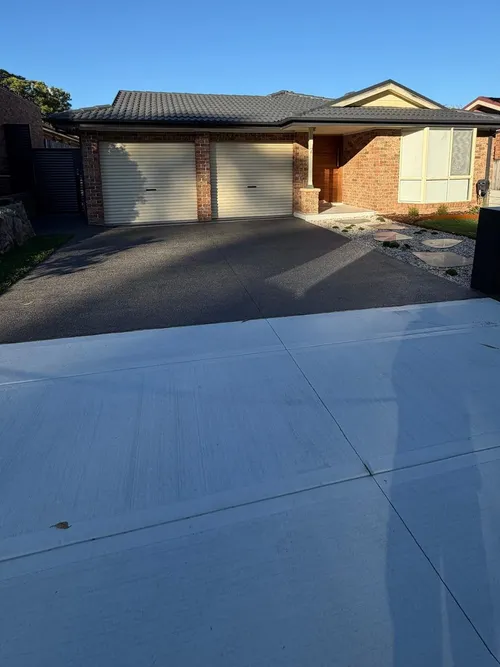 Finished driveway and new front yard landscaping, garage and letterbox at a home in Holsworthy, NSW