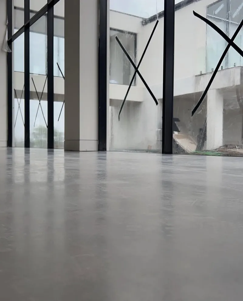 Burnished concrete floor reflecting the glazing, Horsley Park