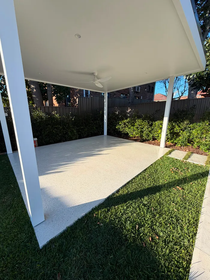 Geostone honed concrete slab under a white cabana in Matraville NSW