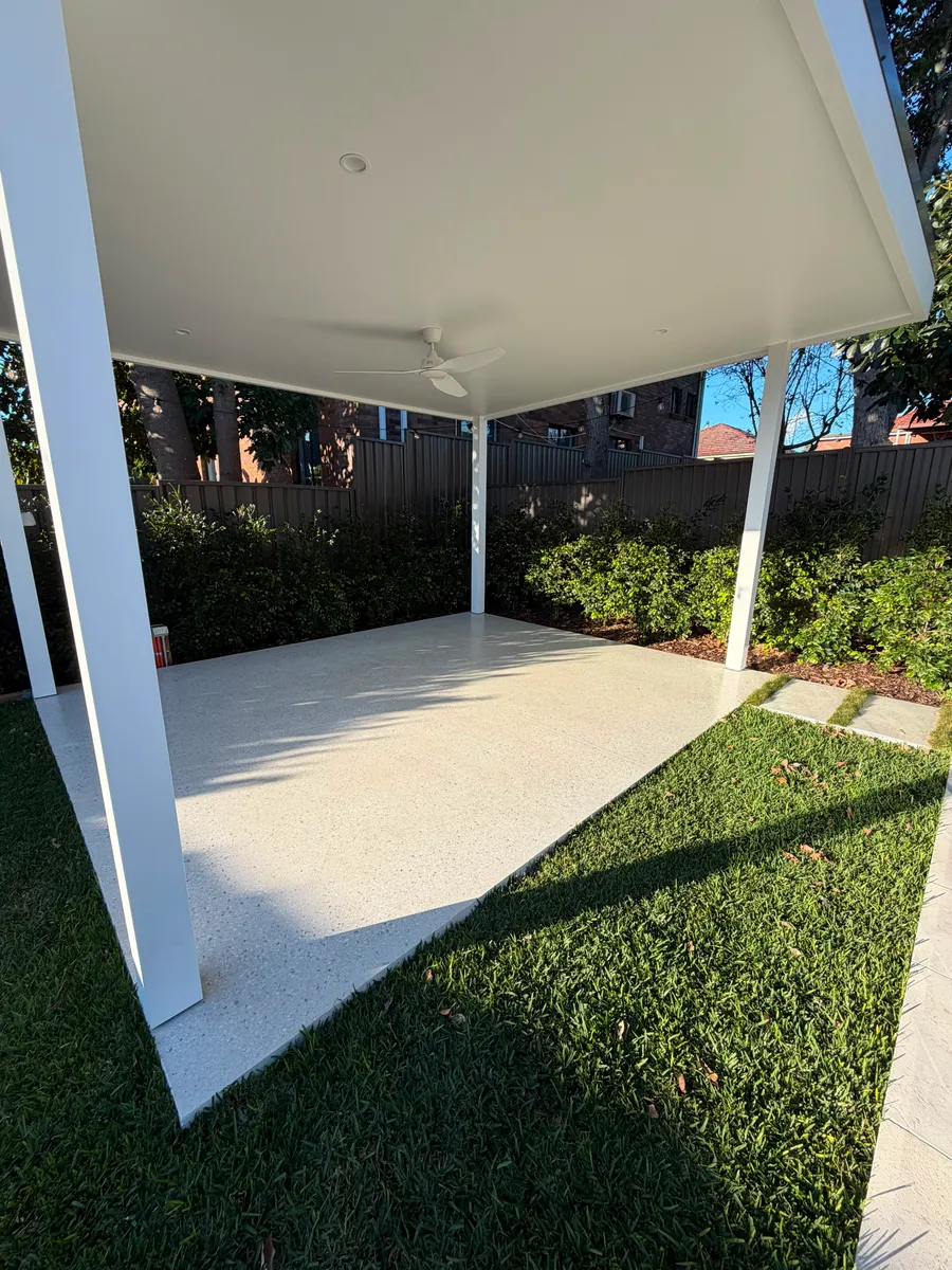 Geostone honed concrete slab under a white cabana in Matraville NSW