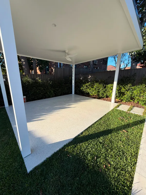 Geostone honed concrete slab under a white cabana in Matraville NSW