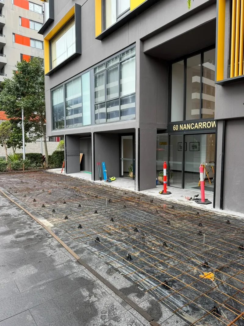 Steel reinforcement laid right up to the glass entrance doors at 60 Nancarrow Ave, ready for the pour