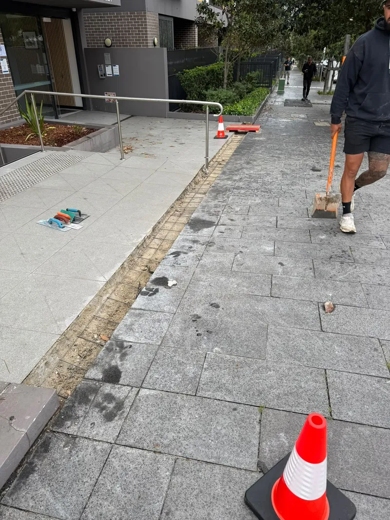 The old tiles ripped out and reinforcement exposed along the entrance, ready for formwork