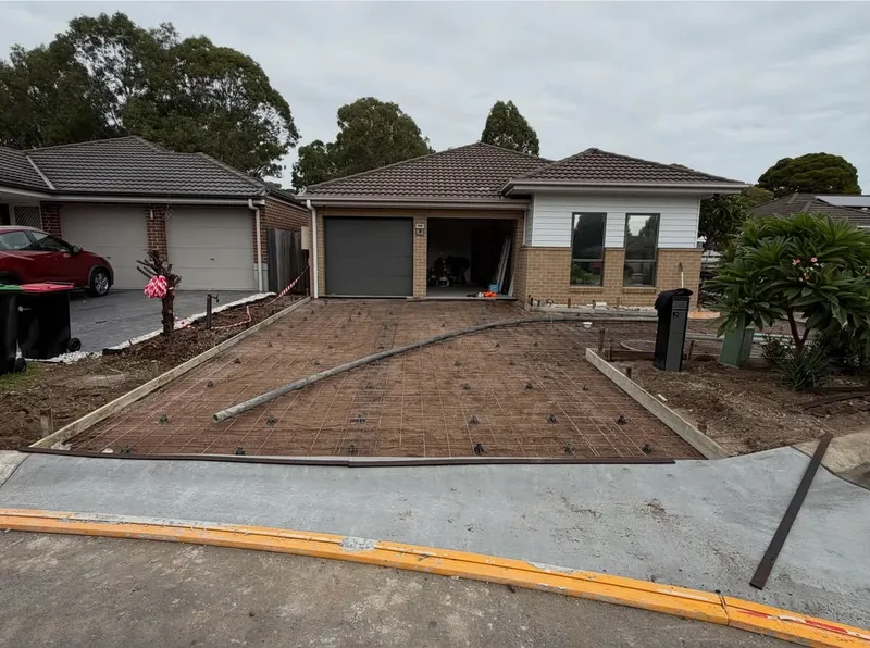 Steel reinforcement and formwork laid out for the Oakhurst driveway before the pour