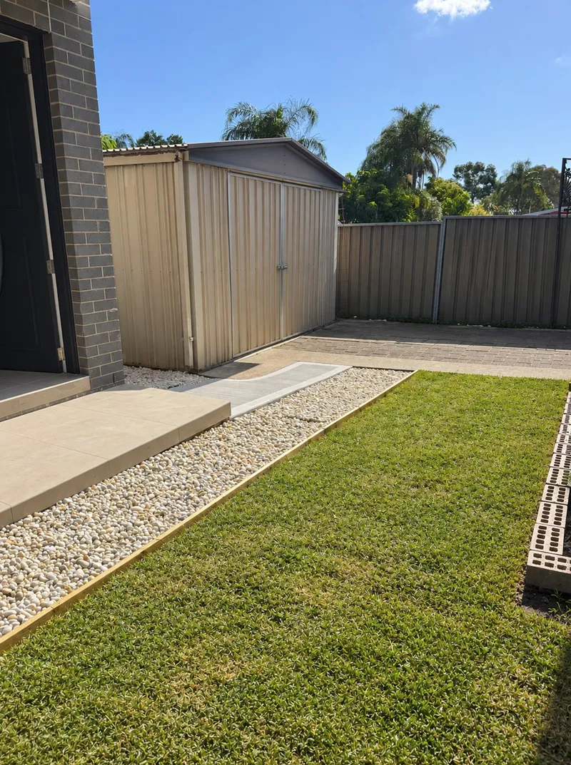 The concrete ramp at Old Toongabbie finished with pebbles and turf laid on either side