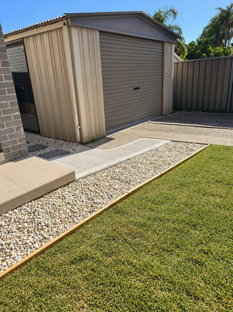 Close view of the ramp, pebbles and turf edge at Old Toongabbie