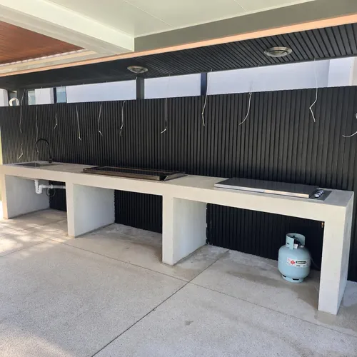 The finished Peakhurst BBQ benchtop run, with the sink, BBQ, cooktop and gas bottle bay