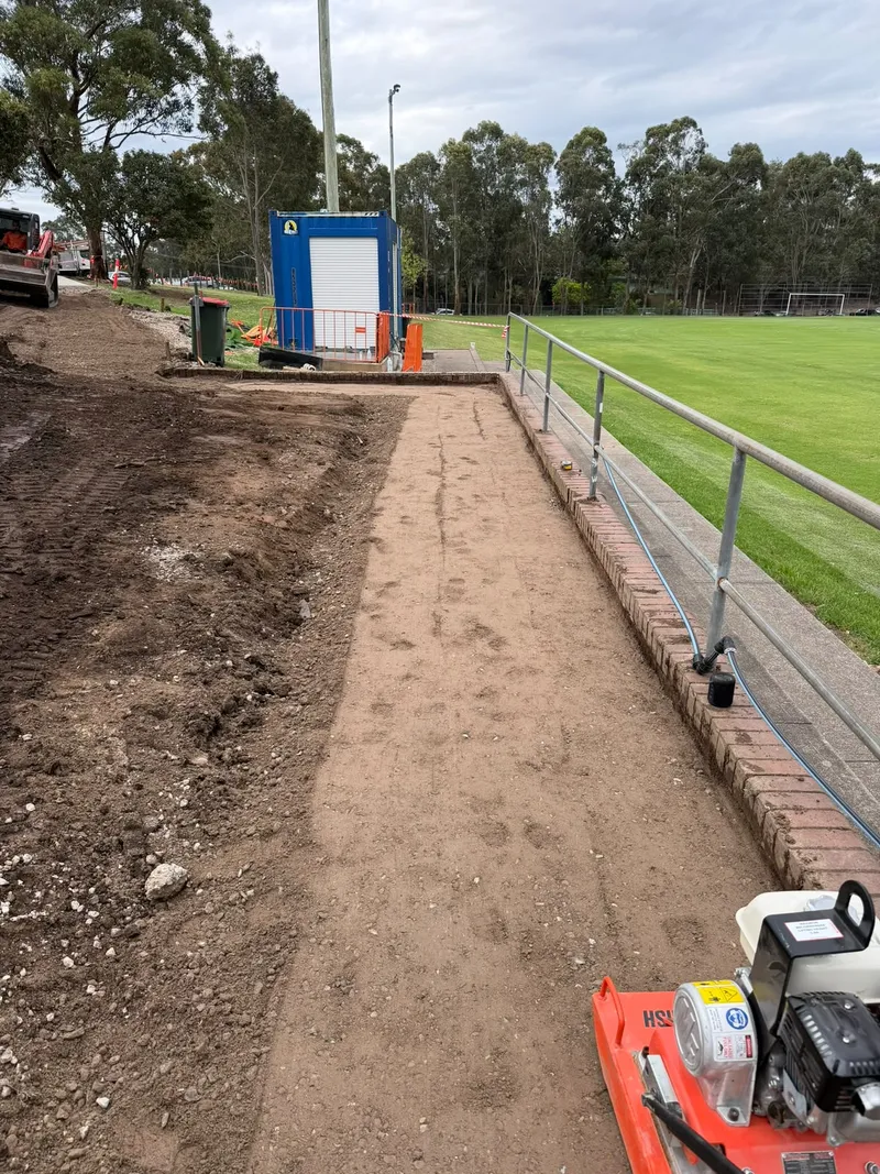 The site excavated and battered to a smooth grade down to the footpath level at Max Ruddock Reserve