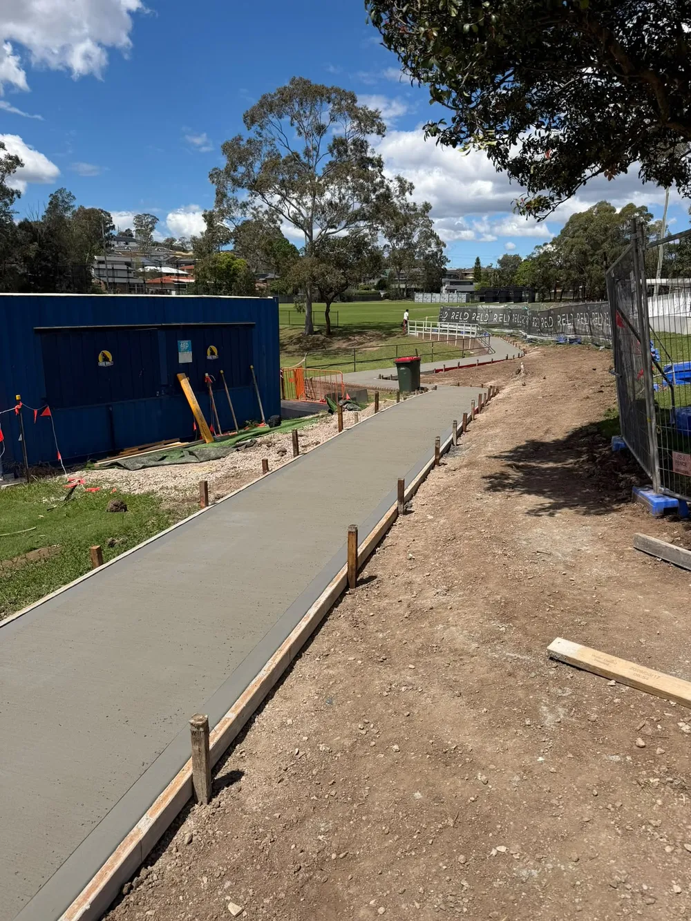 The finished footpath meeting the reinstated pram ramp at Max Ruddock Reserve, Winston Hills